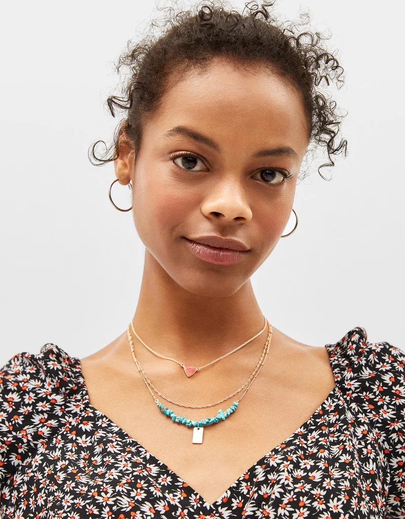Set of necklaces with stone motifs