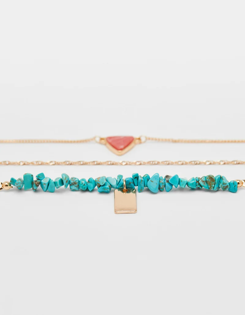 Set of necklaces with stone motifs
